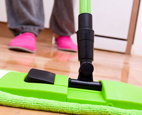 A person mopping the floor