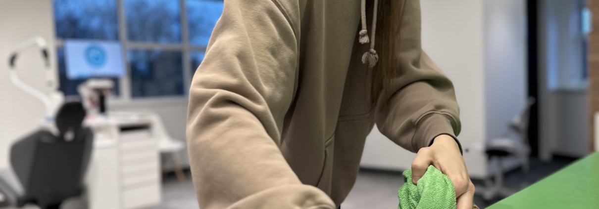 A girl Cleaning The Office Table